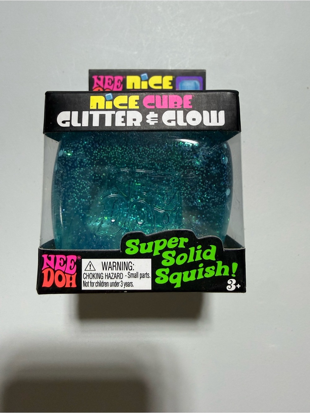 NEEDOH Nice Cube Glitter & Glow Super Solid Squish - blue